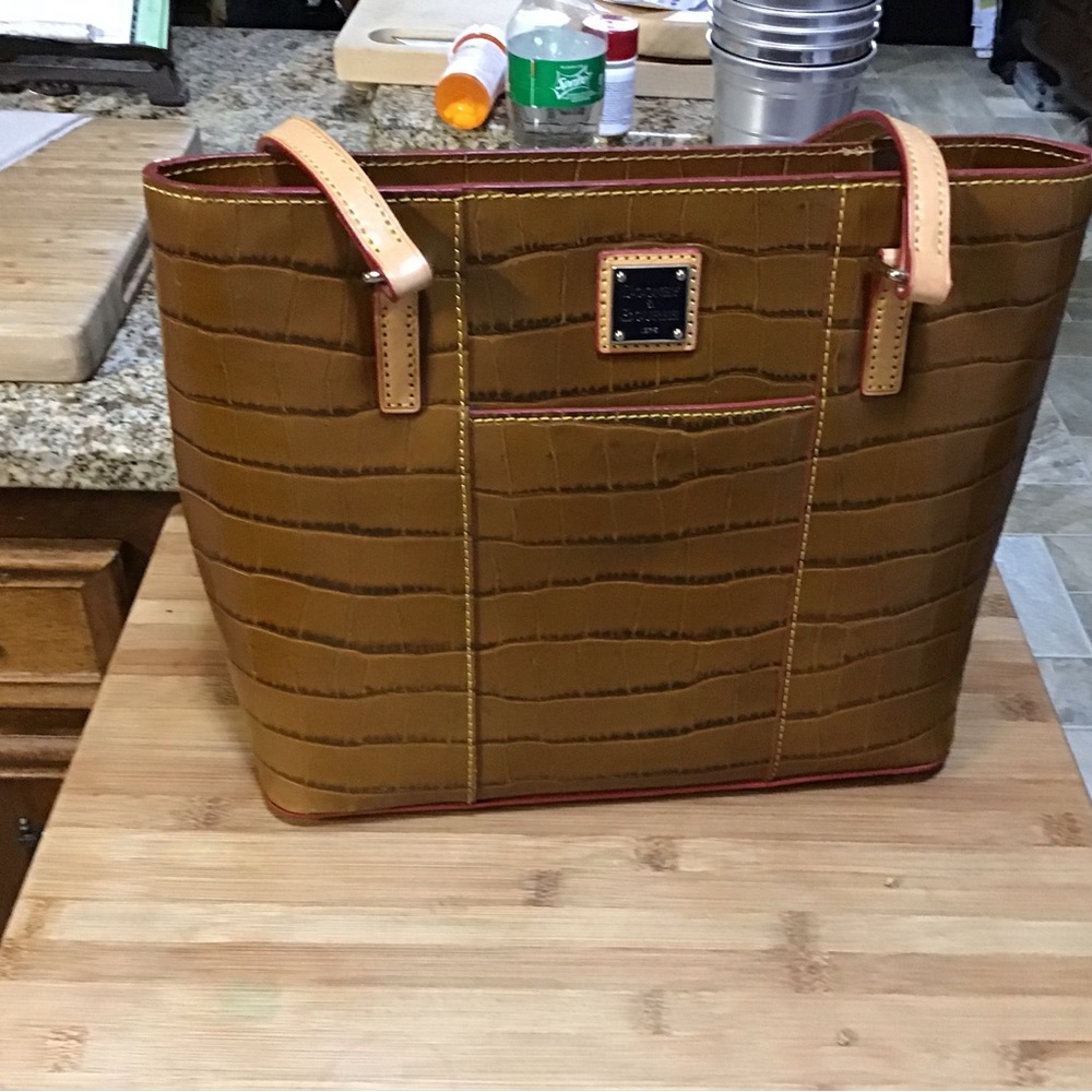 Womens Dooney and Bourke Cognac handbag—11”wide X 10” high.